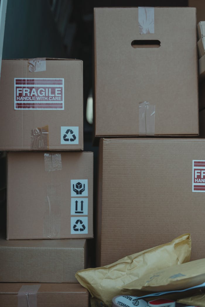 Cardboard boxes with fragile labels ready for shipping and storage solutions.